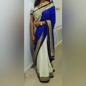 Indian saree in blue gold and cream color comes with the crop top and saree